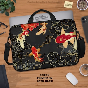 May include: Black laptop bag featuring a koi fish design with red, gold, and white accents. The bag has a black shoulder strap and handle. The text "DESIGN PRINTED ON BOTH SIDES!" is visible on the bottom of the bag.