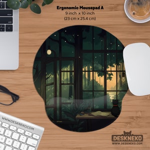 May include: Ergonomic mousepad with a forest scene design. The mousepad is 9 inches by 10 inches. The design features a window overlooking a forest with a black cat. The text "Ergonomic Mousepad A" is at the top.