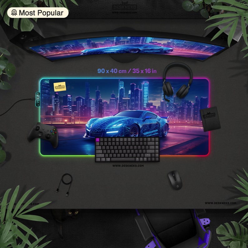 May include: A gaming desk mat with a neon-lit cityscape and a blue sports car design. The mat measures 35 x 16 inches and has a glowing edge. Accessories include a keyboard, mouse, controller, and headphones.