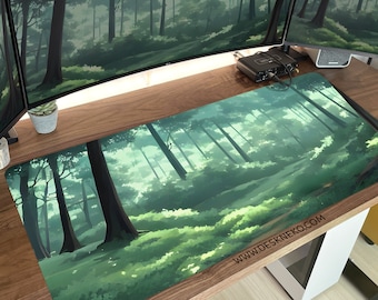 May include: A rectangular desk mat featuring a forest scene with tall trees and lush green foliage. The artwork depicts a misty, sunlit forest with a sense of depth. The mat has the website address www.deskneko.com printed on it.