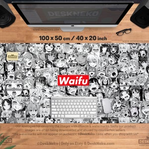 May include: A black and white desk mat featuring a collage of anime-style faces. The mat is rectangular, measuring 40 x 20 inches, with the word "Waifu" in a red box. A keyboard and mouse are on the mat.