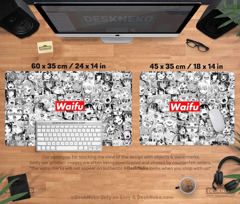 May include: Two black and white desk mats with anime-style character faces. The larger mat is 24 x 14 inches, and the smaller is 18 x 14 inches. Both mats have the word "Waifu" in red. A keyboard and mouse are on the mats.