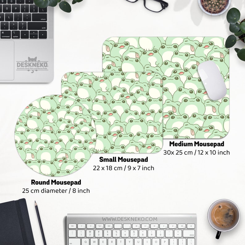 May include: Three mousepads in different sizes, featuring a repeating pattern of cartoon frogs in shades of green and white. The medium mousepad measures 12 x 10 inches, the small is 9 x 7 inches, and the round one is 8 inches in diameter.
