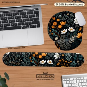 May include: A black floral mouse pad and wrist rest set with white, orange, and green botanical designs. A laptop and mouse are also visible. The text "20% Bundle Discount" is in the top right corner. The website address is visible.