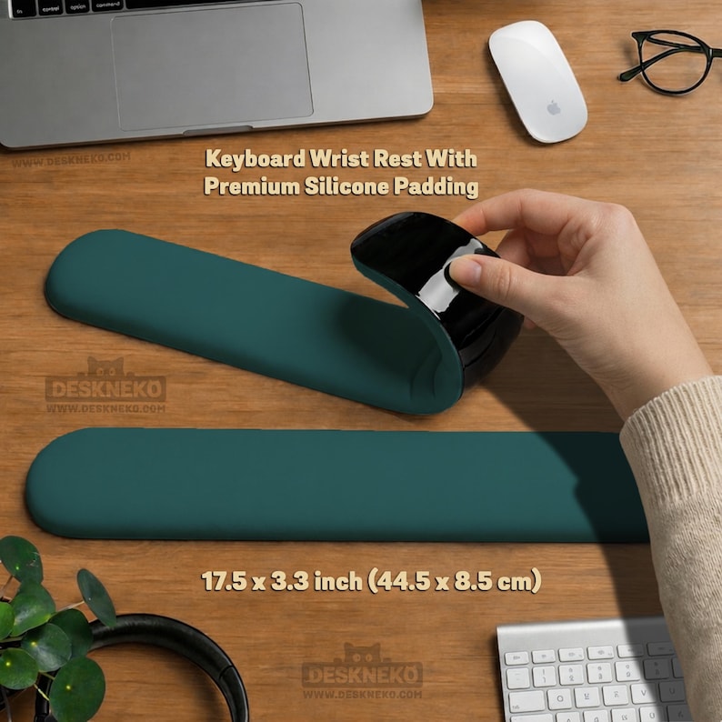 May include: A teal keyboard wrist rest with premium silicone padding. The rest is 17.5 x 3.3 inches. A black mouse is held above the rest. The text "Keyboard Wrist Rest With Premium Silicone Padding" is visible.