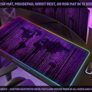 May include: A purple desk mat featuring a world map design, with a multi-coloured illuminated edge. The text "DESK MAT, MOUSEPAD, WRIST REST, OR RGB MAT IN 12 SIZES" is visible. The website www.deskneko.com is also visible.