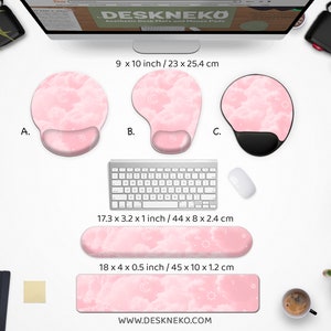 May include: A collection of pink cloud-themed desk accessories, including three mouse pads with wrist rests, a keyboard wrist rest, and a desk mat. The mouse pads are 9 x 10 inches, the keyboard rest is 17.3 x 3.2 inches, and the desk mat is 18 x 4 inches. The website address is www.deskneko.com.
