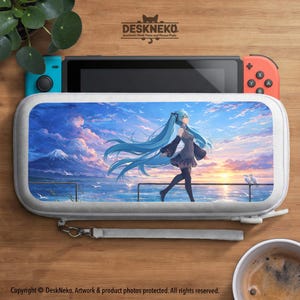 May include: A white Nintendo Switch case featuring an anime character with long blue hair walking along a pier with a sunset backdrop. The case is open, revealing the console. The text "DESKNEKO" is at the top.