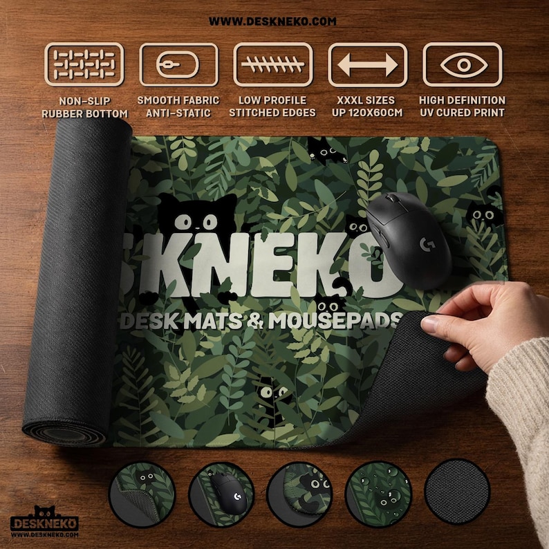 Lifestyle product photo of a DeskNeko desk mat and extra large mousepad on a wooden desk. One side of the desk pad is rolled to show the non-slip rubber bottom, while a hand lifts the corner of the mouse pad to reveal stitched edges and flexible thickness. A black gaming mouse sits on top. Icons highlight smooth fabric, anti-static surface, low-profile edges, and high-definition UV-cured printing. It shows that extra-large and custom sizes up to 120×60 cm are available.