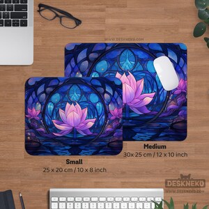 May include: Two rectangular mouse pads with a stained-glass lotus flower design in shades of blue and purple. The smaller pad is 10 x 8 inches, and the larger is 12 x 10 inches. The website address www.deskneko.com is visible.