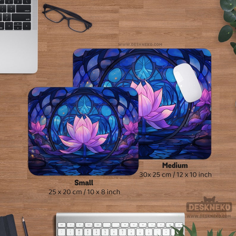May include: Two rectangular mouse pads with a stained-glass lotus flower design in shades of blue and purple. The smaller pad is 10 x 8 inches, and the larger is 12 x 10 inches. The website address www.deskneko.com is visible.