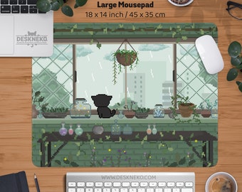 May include: Large mousepad with a pixelated design showing a black cat gazing out of a window on a rainy day. The mousepad is 45 x 35 cm and has a green and brown colour scheme. The text "DESKNEKO" is visible.