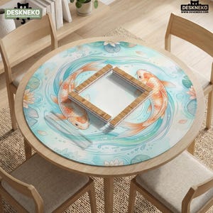 May include: A round desk mat featuring a light blue water design with two orange koi fish swimming in a circle, surrounded by water lilies and lily pads. A square wooden frame is placed in the center. The logo DESKNEKO is visible in the corner.