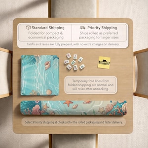 May include: A rolled and folded desk mat featuring a sea-themed design with coral, starfish, and seashells in shades of blue, green, and orange. The mat is shown with a set of Mahjong tiles and a small yellow sticker.