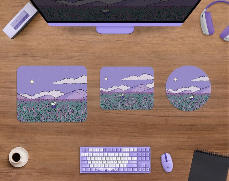 May include: A desktop setup featuring a purple-themed aesthetic. Includes a computer monitor, keyboard, mouse, and three mousepads of different shapes. The mousepads and monitor display a whimsical landscape with a figure in a field of flowers under a night sky.