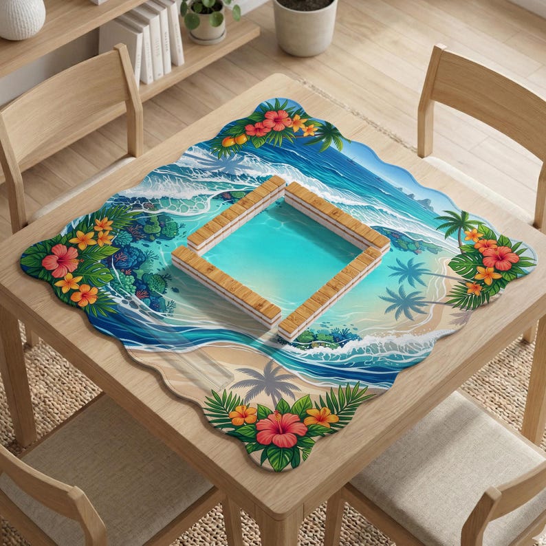 May include: A square table mat with a tropical beach scene. The mat features a turquoise pool, palm trees, and ocean waves. Red and orange hibiscus flowers and green leaves decorate the edges. The mat is placed on a light wood table.