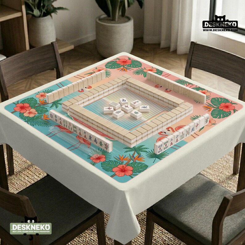 May include: A square mahjong mat featuring a tropical pattern of pink hibiscus flowers, green palm leaves, and flamingos on a gradient background. The mat is topped with a rectangular arrangement of ivory mahjong tiles and a central cluster of tiles.