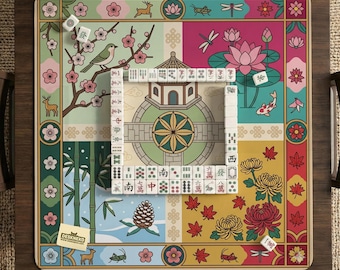 May include: A square mahjong game board with a colorful, segmented design featuring floral, animal, and architectural motifs. The board includes a set of white tiles arranged in a square. The board is set on a wooden tray.