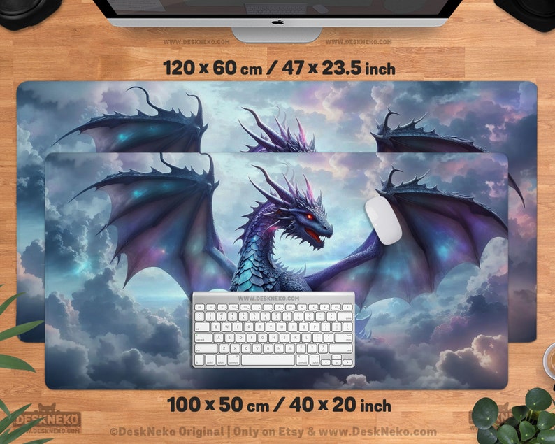 May include: Two rectangular desk mats featuring a fantasy dragon design. The larger mat measures 47 x 23.5 inches, and the smaller one is 40 x 20 inches. The dragon has blue and purple scales, red eyes, and large wings, set against a cloudy sky.