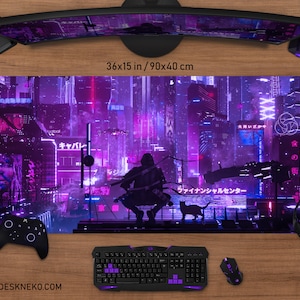 May include: A large rectangular gaming mouse pad with a futuristic cityscape design in shades of purple and pink. The pad measures 36 x 15 inches. A black keyboard, mouse, and controller are visible.