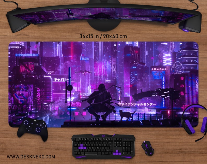 May include: A large rectangular gaming mouse pad with a futuristic cityscape design in shades of purple and pink. The pad measures 36 x 15 inches. A black keyboard, mouse, and controller are visible.
