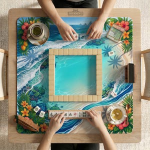 May include: A wooden Mahjong table with a tropical beach scene design. The table features a square playing area with beige tiles, surrounded by a vibrant ocean and floral border. Two people are playing Mahjong, with tiles and tea cups visible.