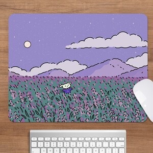 May include: A rectangular mousepad featuring a whimsical illustration of a cartoon character in a lavender field under a starry sky. The design includes mountains, clouds, and a full moon. A white mouse and keyboard are also visible.