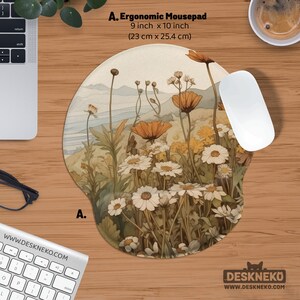 May include: Ergonomic mousepad, 23 cm x 25.4 cm, with a floral design of white daisies and orange poppies. The mousepad has a wrist rest and the text "A. Ergonomic Mousepad". A white mouse is next to the mousepad.