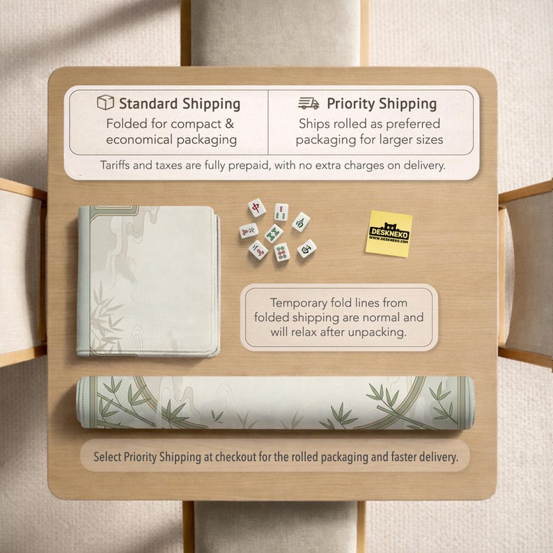 May include: A rectangular play mat featuring a light-colored bamboo and cloud pattern, shown both folded and rolled. The set includes several small white mahjong tiles with green and red characters and a yellow square sticker with the text DESKNEKO.