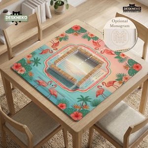 May include: A square mahjong mat featuring a tropical design with pink flamingos, red hibiscus flowers, and green palm leaves on a gradient background. The center displays a wooden tile rack layout with text instructions for gameplay.