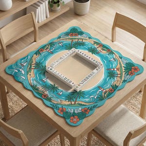 May include: A square wooden table with a decorative mat featuring a tropical island scene. The mat has a turquoise border with palm trees, sailboats, and a lighthouse. A Mahjong set is placed on the mat.