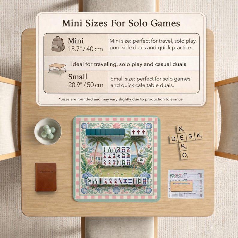May include: A wooden table displays a mini Mahjong set with a tropical design, a small brown notebook, and a bowl of green spheres. A sign reads "Mini Sizes For Solo Games" with size details in inches and centimeters.