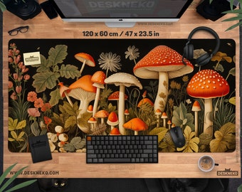 May include: A black desk mat featuring a whimsical illustration of orange and white mushrooms with red caps, surrounded by foliage and flowers. The mat measures 47 x 23.5 inches and has the text "DESKNEKO" and "WWW.DESKNEKO.COM".