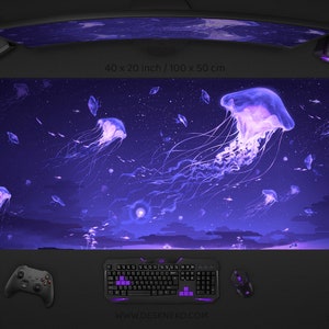 May include: A large, rectangular mouse pad with a vibrant illustration of jellyfish in a deep blue and purple underwater scene. The pad measures 40 x 20 inches. A keyboard, mouse, and controller are visible.