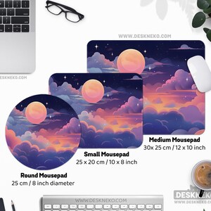 May include: A collection of mousepads with a dreamy night sky design featuring a large, peach-colored moon, clouds, and stars. The mousepads come in round, small rectangular (10 x 8 inches), and medium rectangular (12 x 10 inches) sizes. The website address is visible.