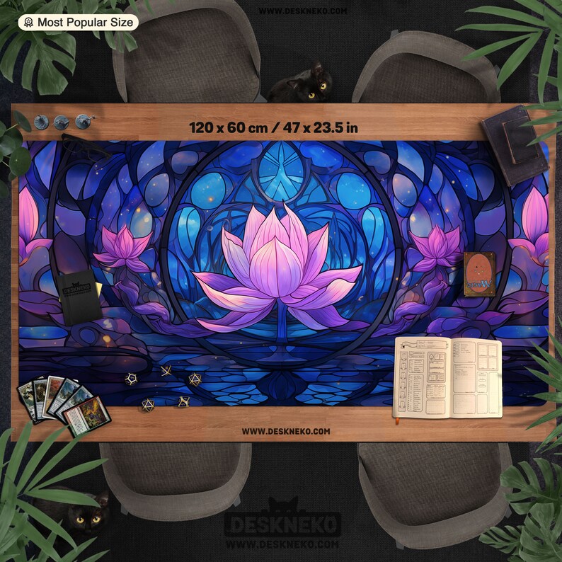 May include: A large, rectangular gaming mat with a floral design, measuring 47 x 23.5 inches. The mat features a central lotus flower in shades of pink and purple, set against a stained-glass style background of blues and purples. The mat is surrounded by gaming accessories.
