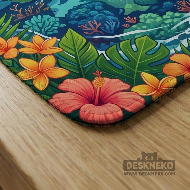 May include: A rectangular desk mat featuring a vibrant tropical pattern with large pink hibiscus flowers, yellow plumeria blossoms, and green monstera leaves. The bottom right corner displays the text DESKNEKO and WWW.DESKNEKO.COM.