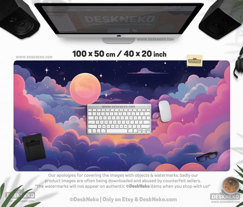 May include: A large desk mat with a dreamy night sky design, featuring a full moon, stars, and fluffy pink and purple clouds. The mat measures 40 x 20 inches and includes a keyboard, mouse, and notebook. The text "DeskNeko" is visible.