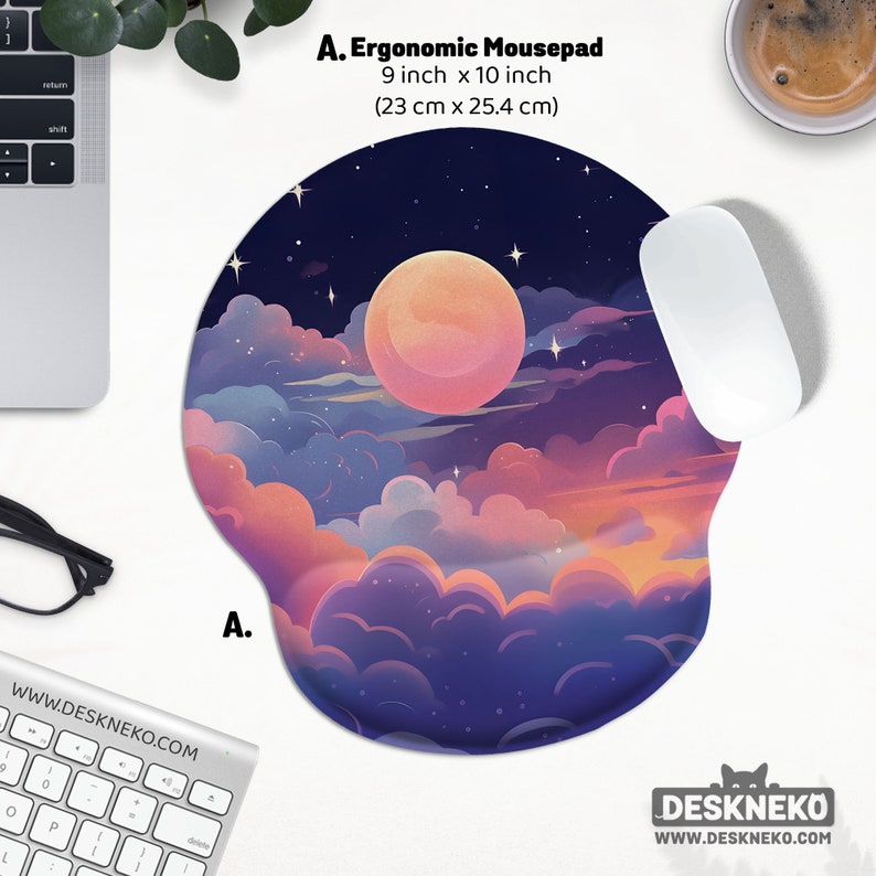 May include: Ergonomic mousepad with a dreamy night sky design, featuring a large pink moon, clouds, and stars. The mousepad is 9 inches by 10 inches. A white mouse rests on the pad. The website address is visible.