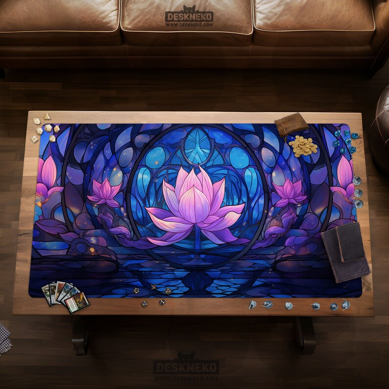 May include: A gaming mat featuring a stained-glass style design with a large pink lotus flower in the center, surrounded by blue and purple hues. The mat is rectangular and has the text "DESKNEKO" at the top and bottom.