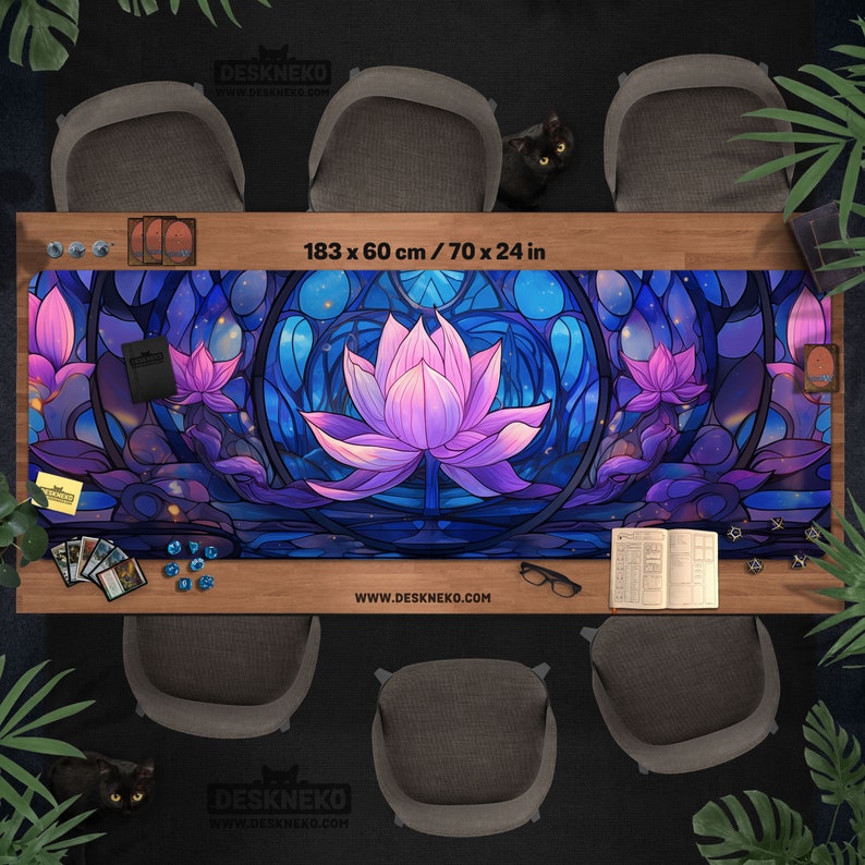 May include: A large, rectangular desk mat with a stained-glass lotus flower design in shades of purple and blue. The mat is 70 x 24 inches and features the website address deskneko.com.