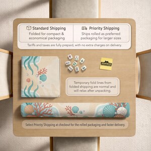 May include: A rectangular mat featuring a light-colored sandy background with illustrations of teal seaweed, coral, and various seashells. The mat is shown in both a folded square configuration and a rolled cylindrical form, accompanied by small mahjong tiles.