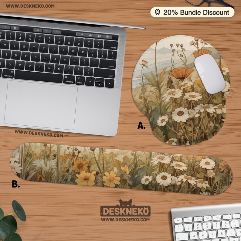 May include: A laptop, white mouse, and matching mousepad and wrist rest are displayed. The mousepad and wrist rest feature a floral design with white daisies and yellow flowers. The website address is visible on the items.