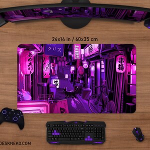 May include: A rectangular desk mat with a vibrant illustration of a Japanese street scene in shades of purple and pink. The design features lanterns, storefronts, a bicycle, and a black cat. The mat measures 24x14 inches.
