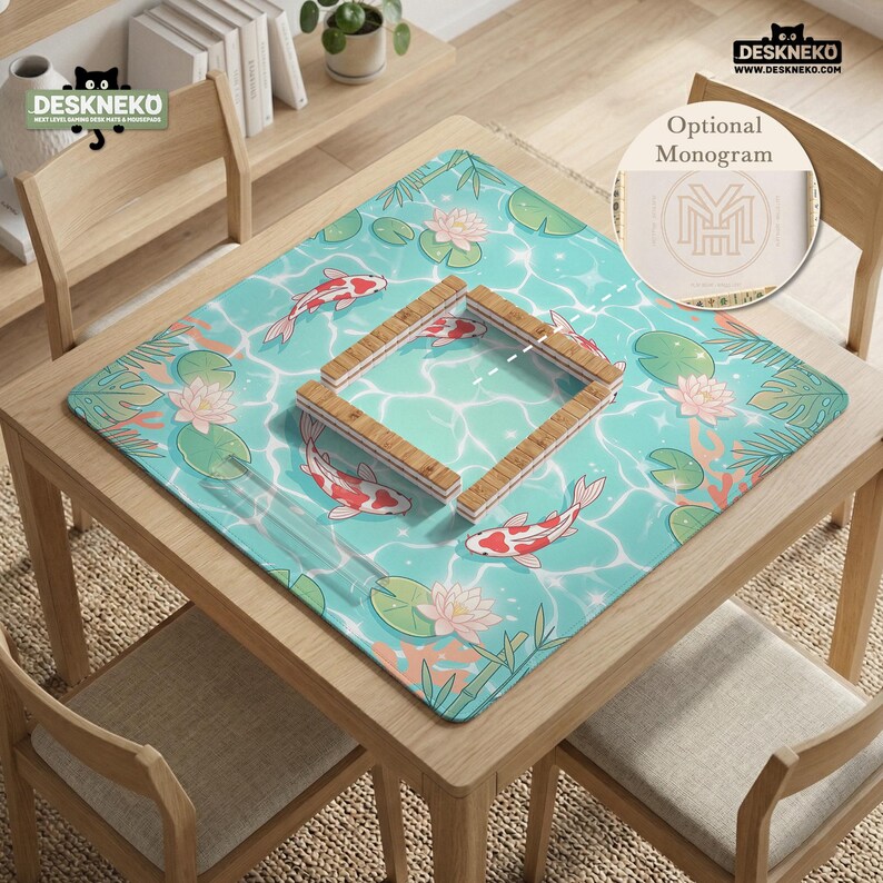 May include: A square desk mat featuring a light blue water surface pattern with red and white koi fish, pink lotus flowers, and green lily pads. A wooden frame sits in the center. The mat includes the text DESKNEKO and an optional monogram circle.
