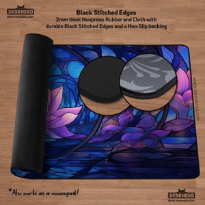 May include: A rolled-up mousepad with a floral stained-glass design in shades of blue, purple, and pink. The mousepad is made of 2mm thick neoprene rubber and cloth with black stitched edges and a non-slip backing. The text "Also works as a mousepad!" is included.