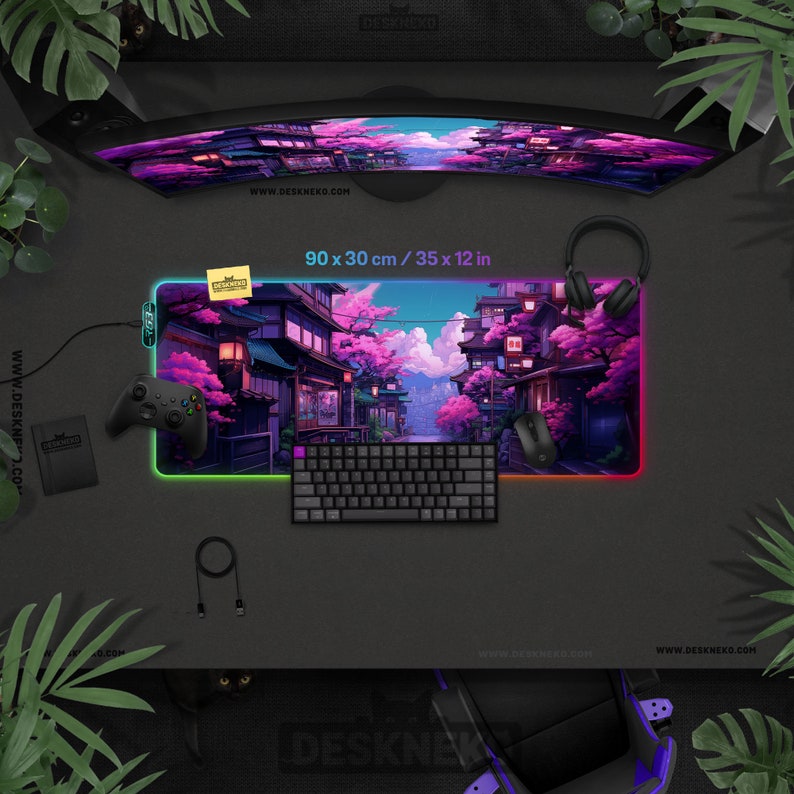 May include: A gaming desk setup featuring a vibrant, illuminated mousepad (90 x 30 cm) with a Japanese street scene. Includes a keyboard, mouse, controller, and headphones. The curved monitor displays a matching image.