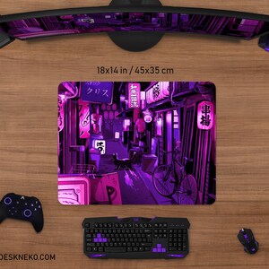 May include: A rectangular mouse pad, 18 x 14 inches, featuring a vibrant illustration of a Japanese street scene in shades of purple and pink. The design includes lanterns, a bicycle, and Japanese text. A black keyboard, mouse, and controller are visible.