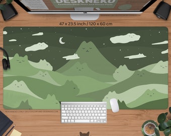 May include: A green desk mat with a mountain and cat design, measuring 47 x 23.5 inches. The mat features a night sky with a crescent moon, stars, and clouds. The text "DESKNEKO" and "Aesthetic Desk Mats and Mouse Pads" are visible.