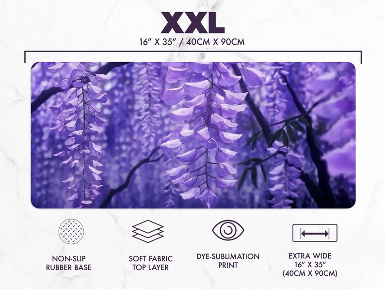 May include: XXL mousepad featuring a vibrant purple wisteria design. The extra wide mat measures 16" x 35" and has a non-slip rubber base and soft fabric top layer. The dye-sublimation print showcases the floral artwork.